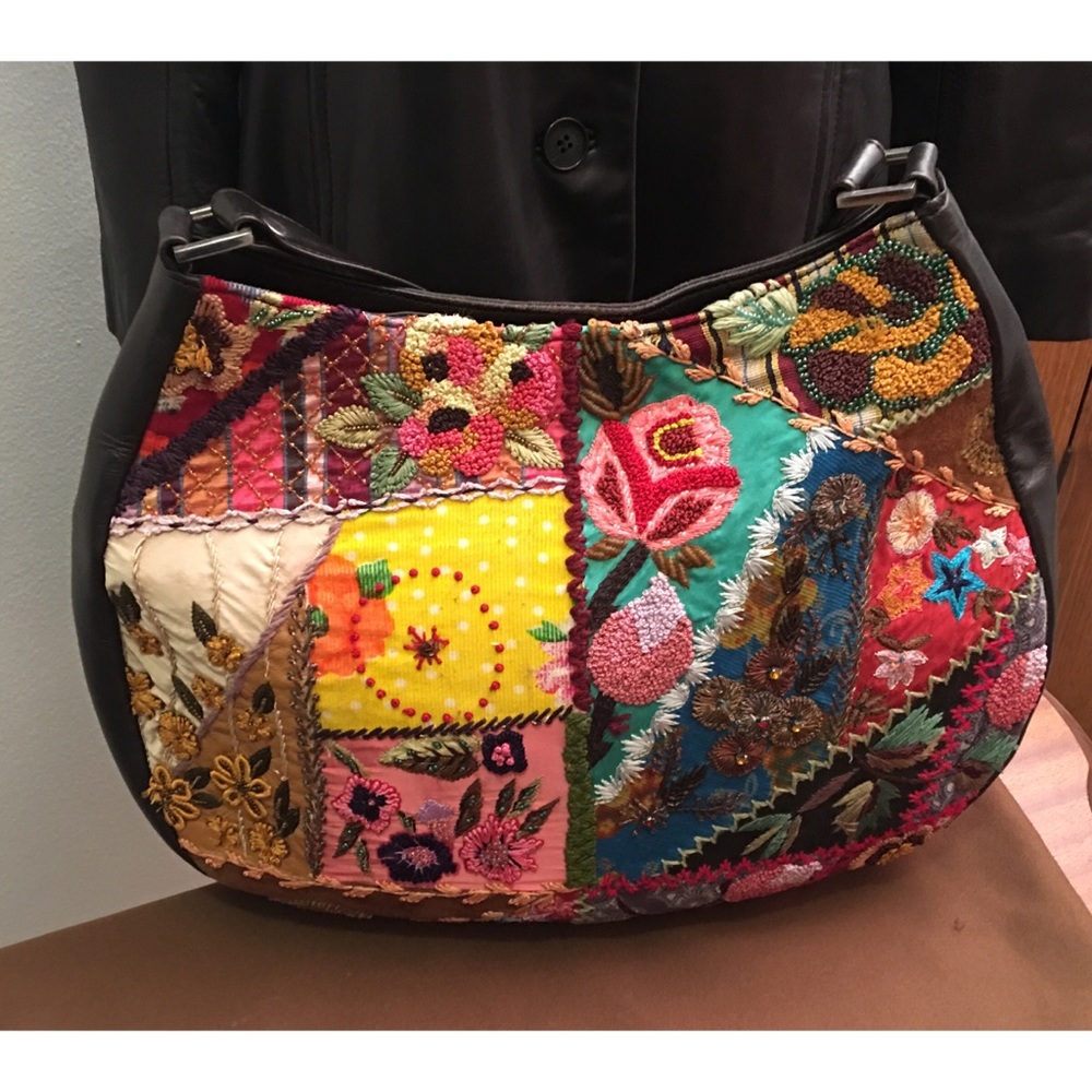 Santi leather and decorative front Handbag